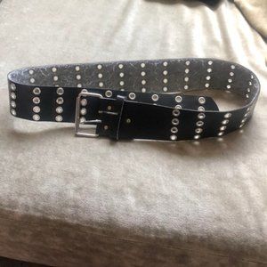 Black belt with silver eyelets